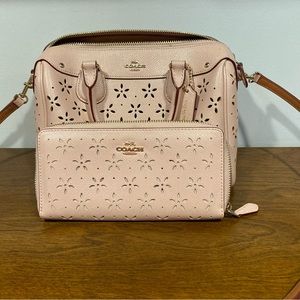 Coach pink floral laser cut crossbody purse and wallet.